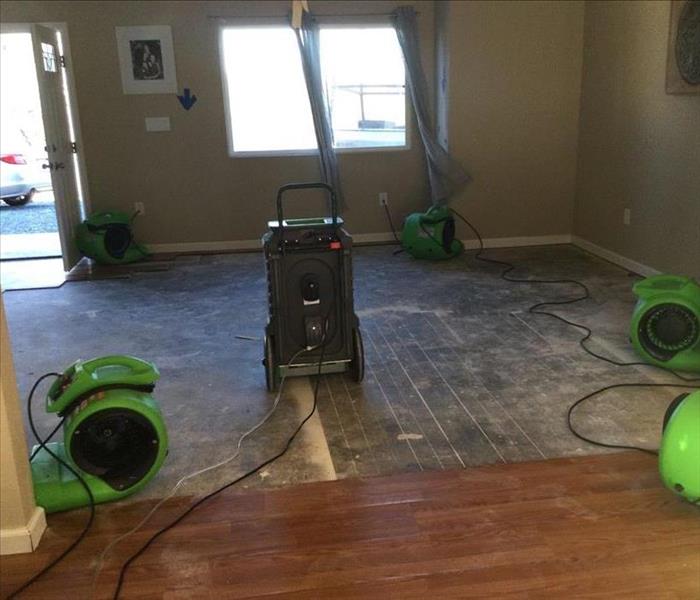no laminate flooring, concrete, open space, with drying machine
