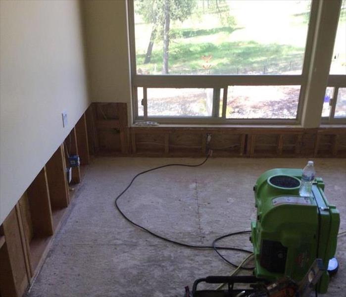 two foot flood cut on drywall with green air machine