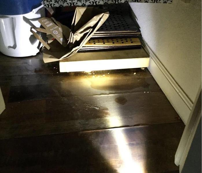 Damaged laminate flooring in a pantry